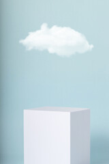 White cube with cloud on blue background. Minimal mock up  for your products.