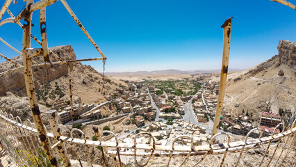 Desert Town Panorama Through Rusted Frame