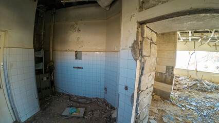 Abandoned Room with Peeling Walls and Debris