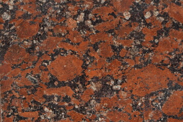Dark stone marble surface with multi-colored inclusions