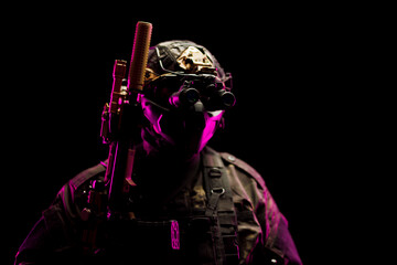 Special forces soldier with tactical gear and night vision in dramatic lighting