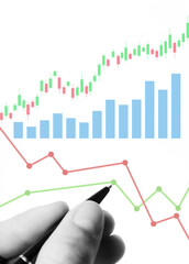 Conducting market analysis to increase sales in business, businessman's hand with pen analyzes...