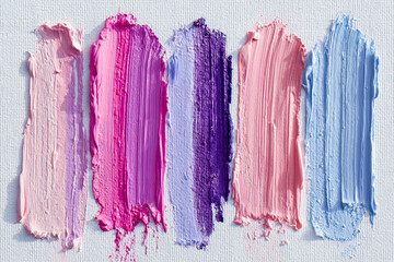 Vibrant streaks of pink, purple, and blue acrylic paint on textured white canvas