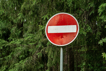 no entry traffic sign in forest area, red circular road sign with white bar, do not enter symbol,...