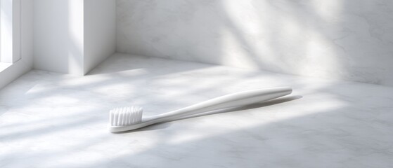 Minimalist Toothbrush Lying on Plain Surface in Bright Bathroom Light