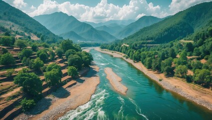 Drone shot of riverbed with mountain, green trees, cloudy sky, river ghat, aerial view, top angle, bright sunny day, beautiful scenery, natural rural tourism destination with empty space for text