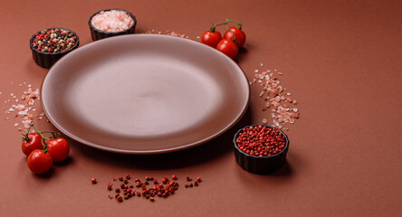 Empty ceramic plate on a monochrome brown background