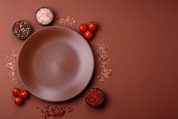 Empty ceramic plate on a monochrome brown background