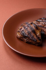 Grilled beef steak meat with salt and pepper. Beef steak grilled on a barbecue