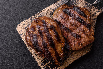 Grilled beef steak meat with salt and pepper. Beef steak grilled on a barbecue