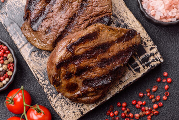 Grilled beef steak meat with salt and pepper. Beef steak grilled on a barbecue