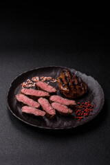Grilled beef steak meat with salt and pepper. Beef steak grilled on a barbecue