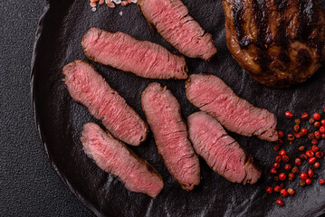 Grilled beef steak meat with salt and pepper. Beef steak grilled on a barbecue