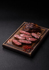 Grilled beef steak meat with salt and pepper. Beef steak grilled on a barbecue