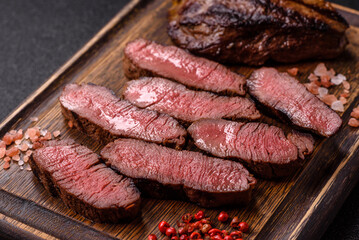 Grilled beef steak meat with salt and pepper. Beef steak grilled on a barbecue
