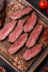 Grilled beef steak meat with salt and pepper. Beef steak grilled on a barbecue