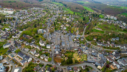 A panoramic aerial view around the old town in the city Freudenberg, Germany on a cloudy spring day