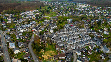 A panoramic aerial view around the old town in the city Freudenberg, Germany on a cloudy spring day