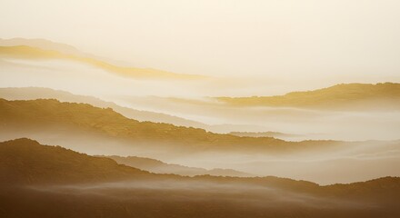 Golden mist envelops rolling hills at dawn, creating a serene landscape of layered textures and soft hues