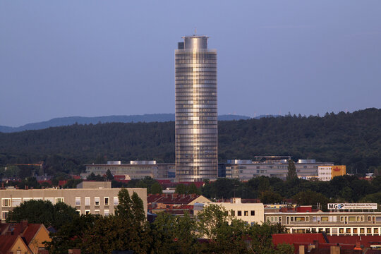 Nuremberg, Germany - August 25, 2023: Business Tower Nuernberg office skyscraper owned by Nuremberg Insurance, with cylindrical glass facade in Bavaria, Germany