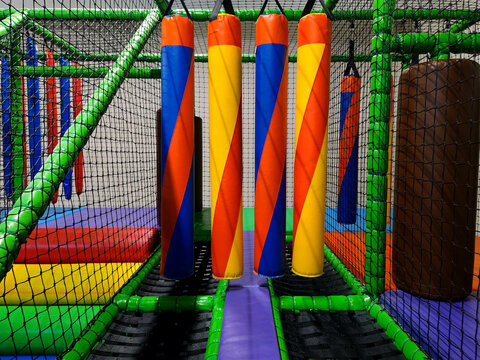 Colorful Multicoloured Vibrant Indoor Soft Obstacle Jungle Gym Course At A Kids Playground Without Logos Or Trademarks.