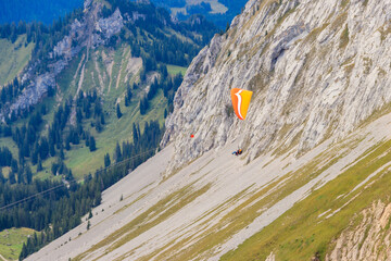 Paragliders flying from Pilatus mountain in Swiss Alps, Switzerland. Concept of active lifestyle and extreme sport adventure