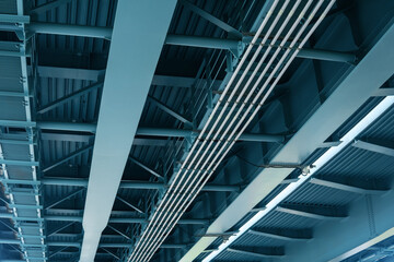 view from below of the bridge supporting beams, close up of steel structure