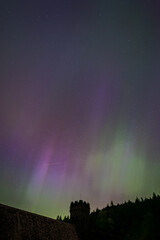 Northern lights over the silhouette of Derwent Dam