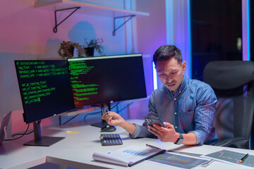 Male programmer looking stressed out while working on difficult project at workplace
