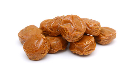 Caramel candies isolated on white background