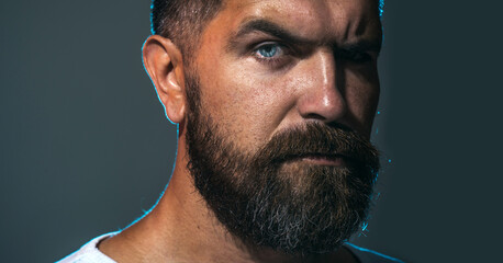 Man portrait. Closeup portrait of handsome bearded man. Fashionable brutal guy with beard and...