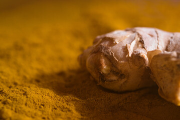 Turmeric root and turmeric powder. Medicinal plant and considered superfood.