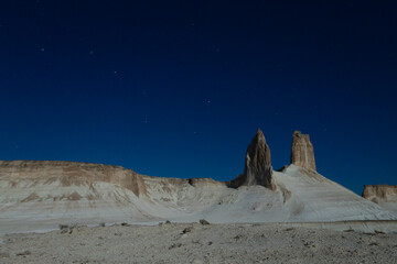Night scene with the rock pinnacles of Bozzhira valley, Kazakhstan