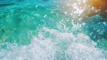 Crystal clear aqua waters sparkle under the sunlight, creating a refreshing and vibrant scene depicting serenity and the beauty of nature at the shore.