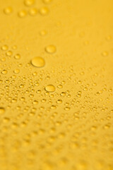 the surface covered with water droplets is saturated yellow , a beautiful wet yellow film in a large number of water droplets