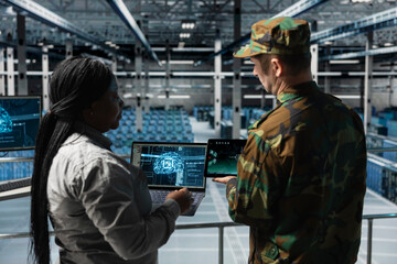 Team of army workers in data center identifying potential threats through automated AI scanning....