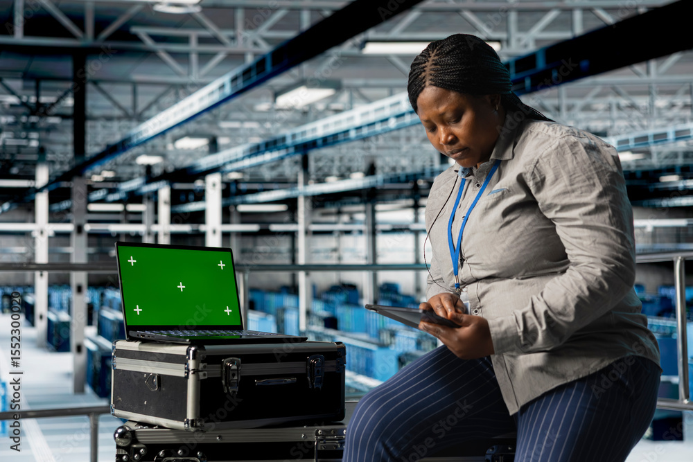 Poster mockup laptop next to female engineer in server hub using tablet to optimize hardware performance. a