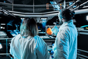 Team of astronauts doing brainstorming before landing spaceship on Mars. Teamworking orbit station...