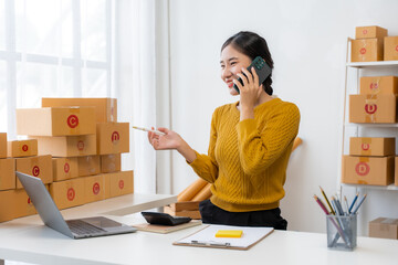 Asian Woman Managing Small Business from Home