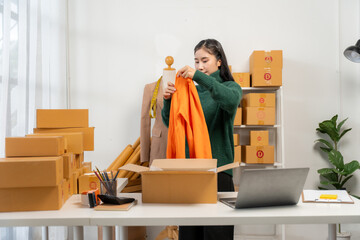 Woman Packing Apparel for Online Business