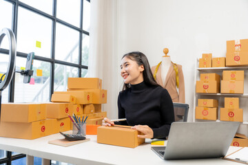 Asian Woman Running Online Business from Home