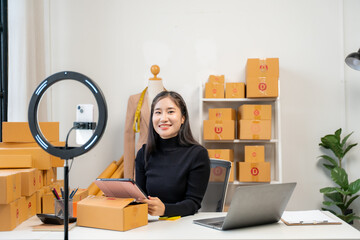 Asian Woman Running Online Business from Home