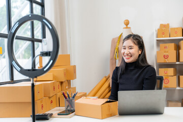 Asian Woman Running Online Business from Home
