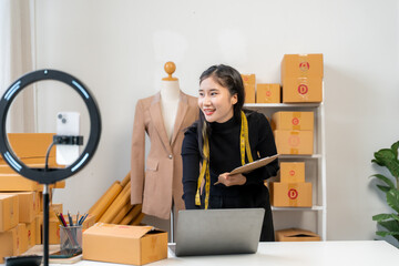 Asian Woman Entrepreneur Recording Video for Online Business