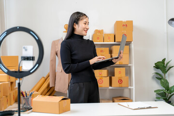 Asian Woman Running Online Business from Home