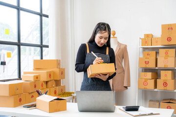 Woman Preparing Packages for Shipping in Home Office