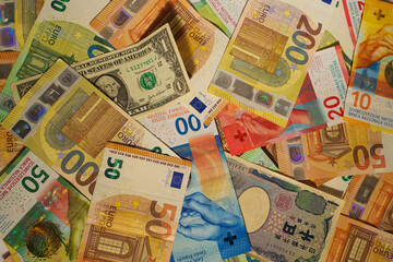 Background of Mixed International Currency Banknotes Close-up