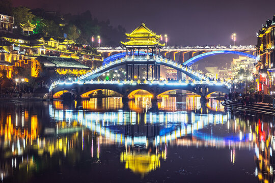 Historical buildings along the river Tuojiang at evening time.