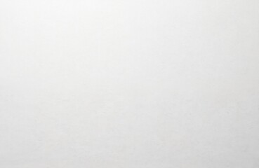 Fototapeta premium Close-up of watercolor paper texture. White background with a rough, uneven surface. Blank page for art, craft, design projects. Perfect for backgrounds, wallpaper, cards.