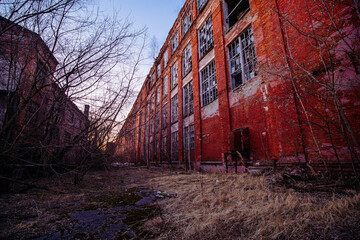 Territory of abandoned industrial area. Large old red brick industrial buildings